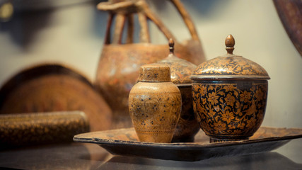 Wall Mural - Engraved flowers on a small cup and lid