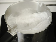 Bags With Cereals Boil In A Pan. Cooking Food. Boiling Water.
