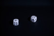Two dice on black background