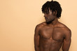 © LIGHTFIELD STUDIOS - handsome african american shirtless man on beige