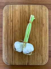 2 vineyard fresh garlic on cutting board