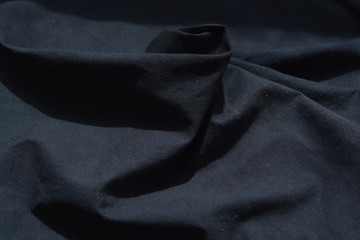 Black cloth in a rippled pattern