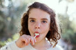 © RooM The Agency - Portrait of a girl eating a lollipop