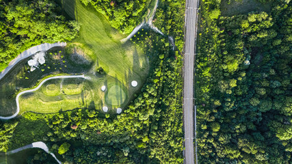 Poster - Drone view of a golf course next to a railway