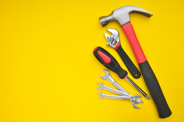 Group of tools on yellow background