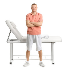 Poster - Portrait of massage therapist on white background