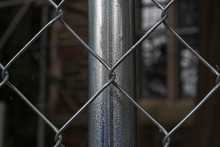 Close-up Of A Chain Link Fence With Metal Fence