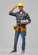 © Syda Productions - profession, construction and building - happy smiling indian builder in helmet with blueprint over grey background