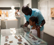 © JackF - Father and daughter looking at stands with exhibits