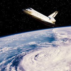 Wall Mural - shuttle above the earth. the elements of this image furnished by nasa.