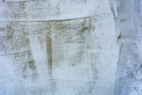 Fototapeta Las - Texture of a concrete wall with cracks and scratches which can be used as a background
