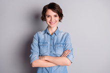 Photo Of Attractive Business Lady Wavy Bobbed Hairdo Arms Crossed Self-confident Chief Worker Beaming White Teeth Smile Wear Casual Denim Shirt Isolated Grey Color Background