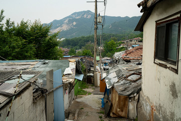 Wall Mural - Seoul's last shanty town. Known as Village 104 it is only half filled with residents who live among empty neighbors waiting for demolition. 