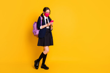 Sticker - Full body photo of high student blogger girl use smartphone covid-19 repost news wear long socks skirt black blazer jacket rucksack medical mask isolated bright shine color background