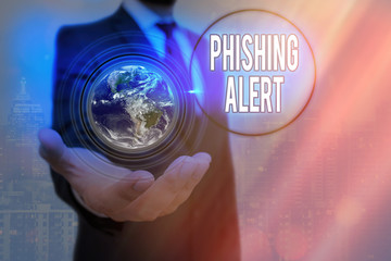 Poster - Writing note showing Phishing Alert. Business concept for aware to fraudulent attempt to obtain sensitive information Elements of this image furnished by NASA