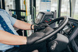 Close up portrait of young hispanic bus driver wears black protecting gloves