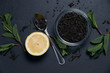 © Oksana Smyshliaeva - tea with mint and lemon on a dark background