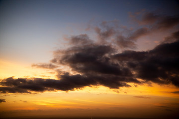 Colorful dawn / dusk sky with dark clouds