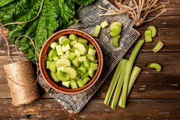 Wall Mural - Rhubarb on a wooden background. Cooking rhubarb. Food recipe background