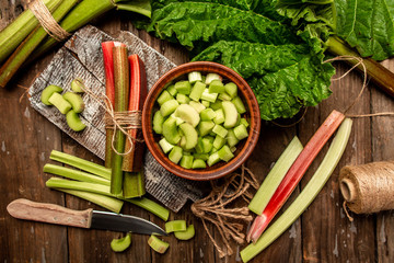 Wall Mural - rhubarb stems on wooden surface. banner menu recipe Cooking background