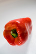 Fresh red whole pepper on the white background