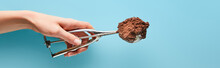 Cropped View Of Woman Holding Scoop With Chocolate Ice Cream On Blue Background, Panoramic Shot