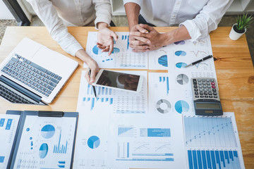 Leinwandbilder - Business casual team manager having a discussion with new project success financial statistics, Partner meeting professional investor working start up project for both company with document