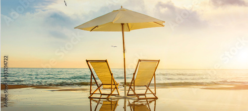 Cuadros en Lienzo Background with couple of deck chairs at sunset, Travel concept, Summer backgrou