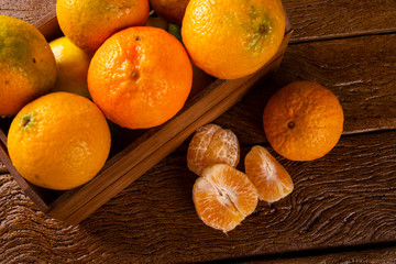 Wall Mural - Tangerine box on wooden table