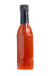 glass bottle of chili sauce on a white background