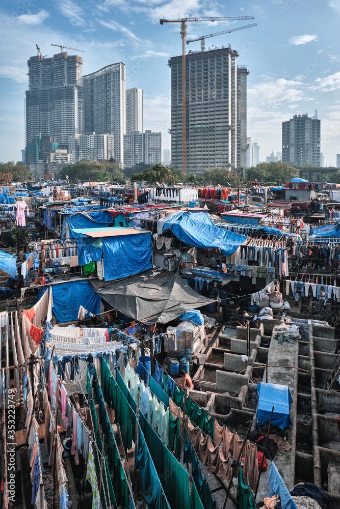 View of Dhobi Ghat (Mahalaxmi Dhobi Ghat) is world largest open air laundromat (lavoir) in Mumbai, India with laundry drying on ropes. Now one of signature landmarks and tourist attractions of Mumbai - obrazy, fototapety, plakaty 