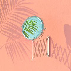 Wall Mural - creative summer layout made of pink wall, mirror and palm leaves. pastel colors. nature concept. min
