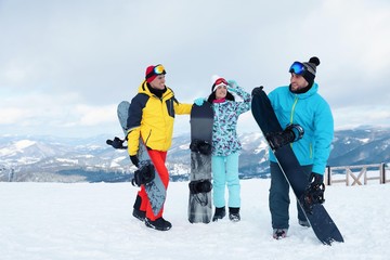 Poster - Group of friends with equipment in snowy mountains. Winter vacation