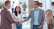 © ASDF - two business men shaking hands, greeting each other