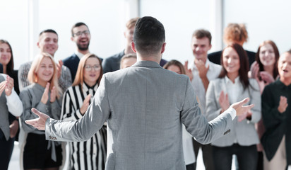 businessman speaking with addressing his business team.