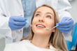 © Proxima Studio - Woman having teeth examined at dentists