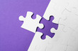 © New Africa - White puzzle with unfitting piece on purple background, flat lay