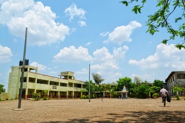 An old village school and cloudy sky