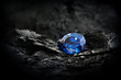 blue sapphir on black coal background