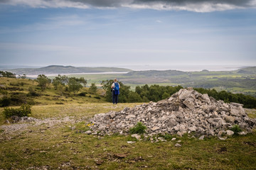 Whitbarrow is a hill in Cumbria, England. Designated a biological Site of Special Scientific Interest and national nature reserve, it forms part of the Morecambe Bay Pavements