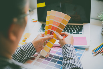 Fototapete - The graphic designer creative team is currently working on the design and color selection on the guide color for advertising design.