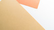 © Vagengeim - Colorful pastel paper stacks background. Abstract white beige copper brown colors. Minimalism geometric flat lay backdrop. Top view
