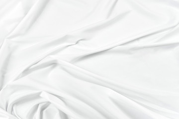 Abstract white fabric texture background. Cloth soft wave. Creases of satin, silk, and cotton.	