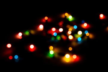 Wall Mural - colorful bokeh from chrismas light on black background