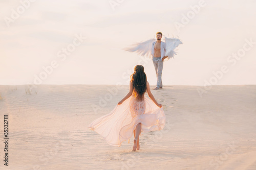Fotomural Mysterious Silhouette Woman runs to her divine guardian angel man with white wings