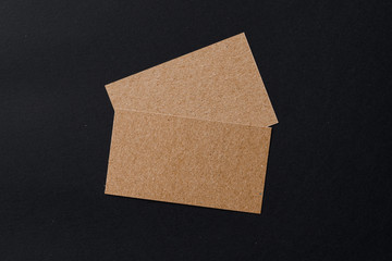 Poster - Business card of a craft paper on black background