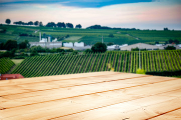 Wall Mural - A table in a vineyard in a beautiful holiday sound with the sunset giving an amazing mood