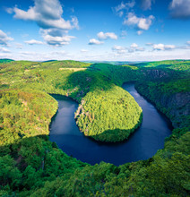 Astonishing morning view of Vltava river horseshoe shape meander from Maj viewpoint. Breathtaking summer scene of mountain canyon in Czech Republic. Beauty of nature concept background..