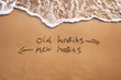 © Song_about_summer - old habits vs new habits, life change concept written on sand