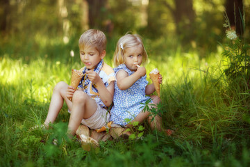 Wall Mural - children boy and girl eating ice cream on the street, happy man, summer in the village